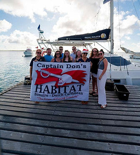 Divers on the dock at Captain Don's Habitat, Bonaire